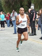 Photo of Jose Morales winning the 10 miler by writer Angela Young