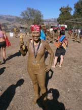 Angela Young covered in mud. Photo by Alheli Curry.