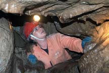Photo of Patti Daniels spelunking in the Moaning Caverns